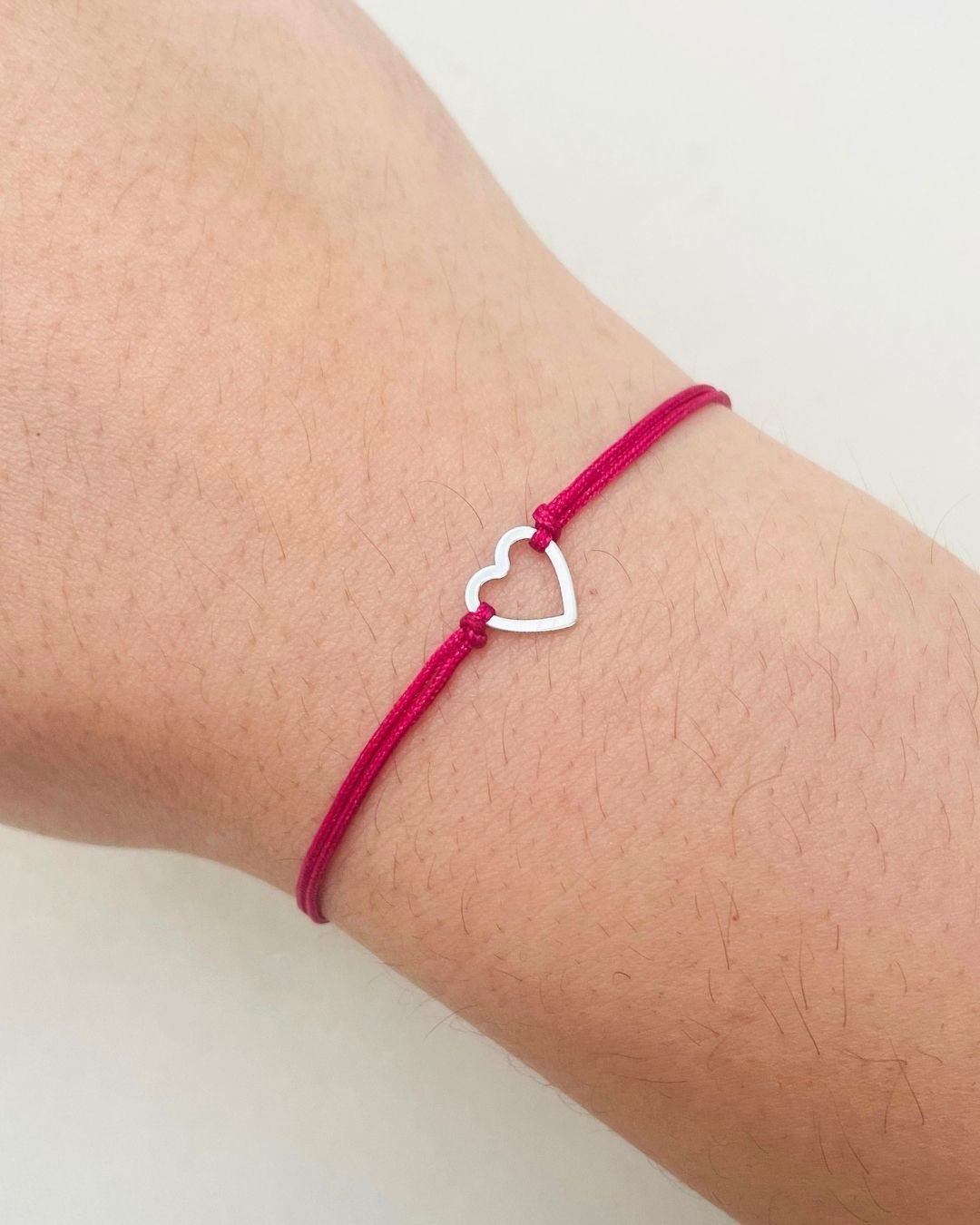 PULSEIRA CORAÇÃO VAZADO CORDÃO ROSA CEREJA E PRATA 925