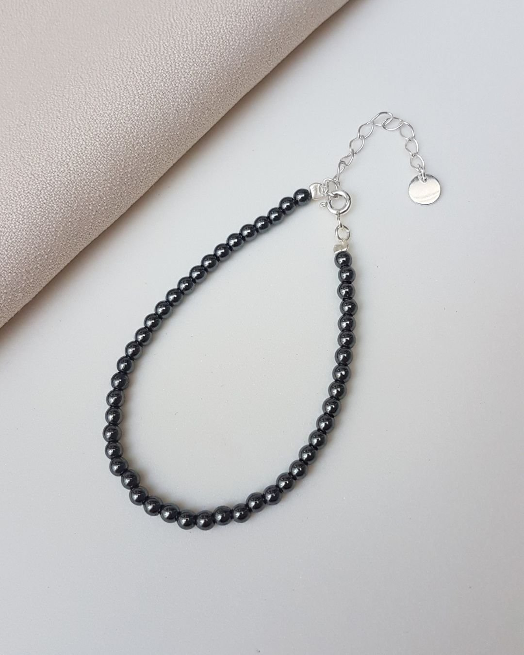 PULSEIRA PEDRAS HEMATITAS BOLINHAS 3MM E PRATA 925