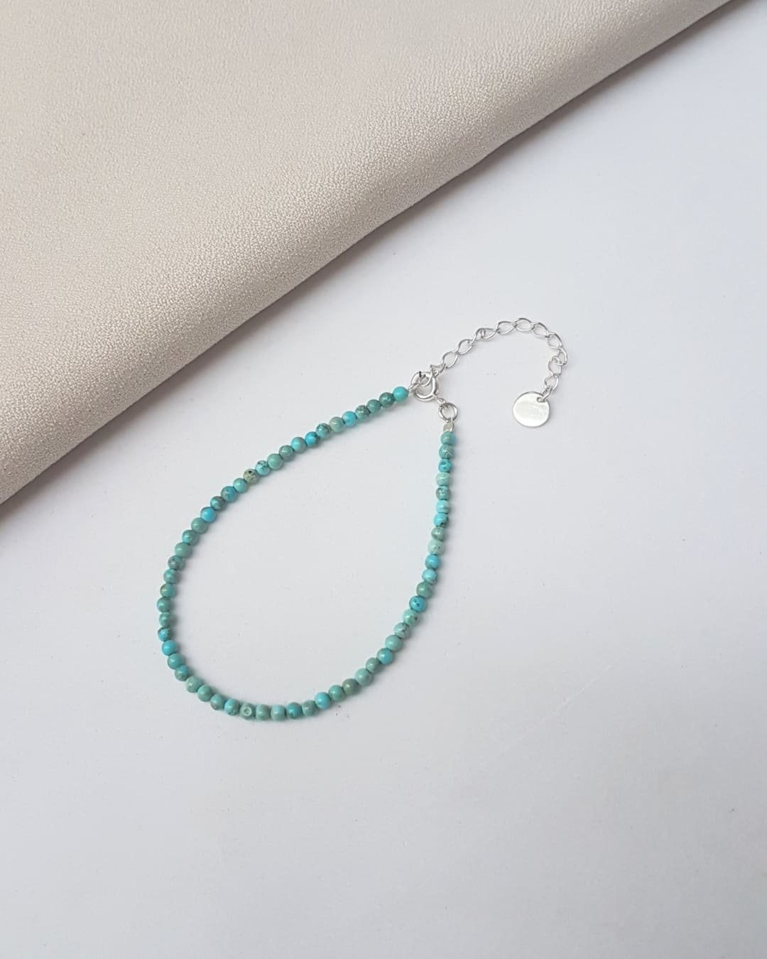 PULSEIRA PEDRAS HOWLITA BOLINHA 2 MM